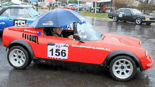 Jeff Jackson does his best to stay dry before he takes to the track in his custom built, one-of-a-kind vehicle at the Leyburn Sprints at the weekend. Jeff Jackson does his best to stay dry before he takes to the track in his custom built, one-of-a-kind vehicle at the Leyburn Sprints at the weekend.